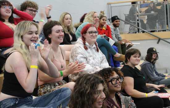 Students laugh and smile during Dirty Bingo