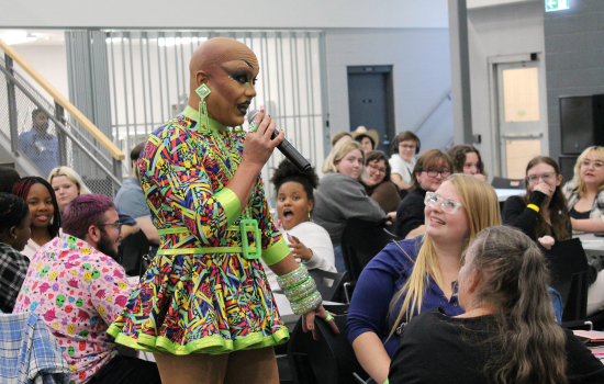 Drag Queen Sabin addresses a group of students during Dirty Bingo