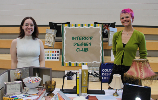 Interior Design Club members at their booth in the SLC