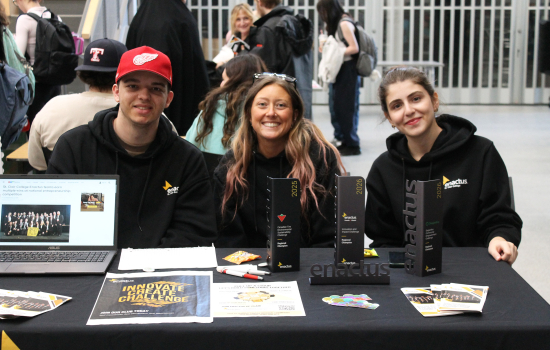 Club members at their booth in the SLC