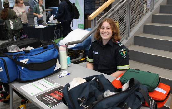 Paramedic Club member at their booth in the SLC