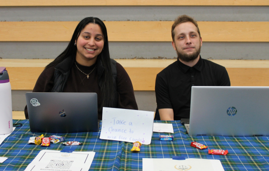 Club members at their booth in the SLC