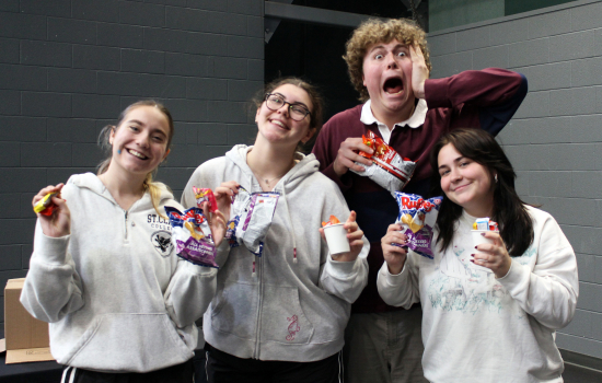 Students strike a pose and show off their free treats