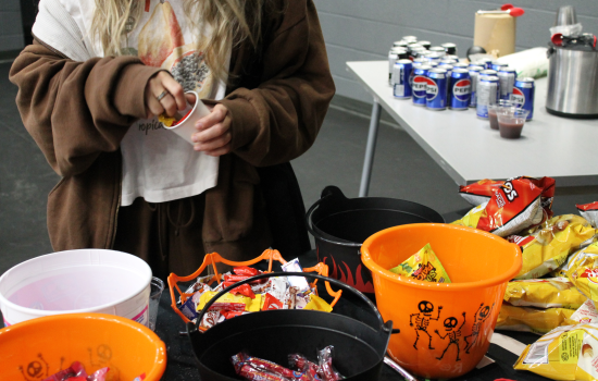 A close up of a student utilizing the candy bar