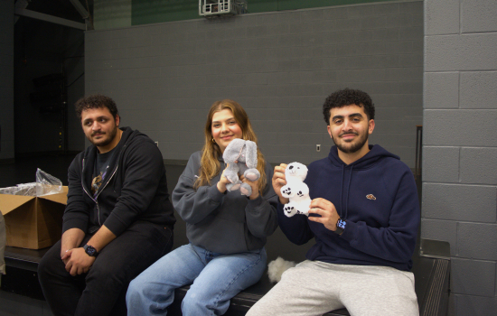 Board members and students show off their besties