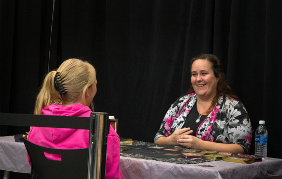 A student receives a tarot reading