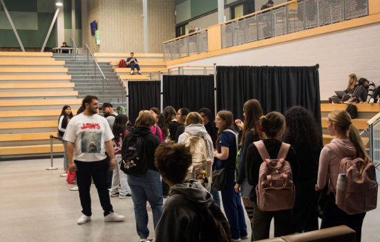 Students wait for their turn with a psychic