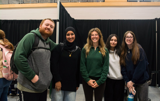 Smiling students wait for their turn with a psychic