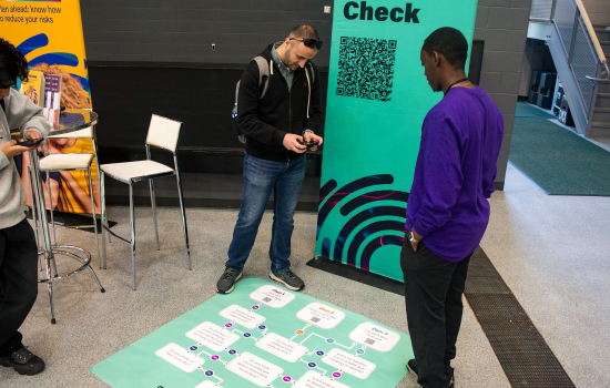 Students engage with staff at the Reduce Your Risk event