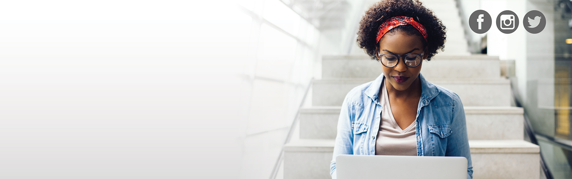 Femal student working on laptop.